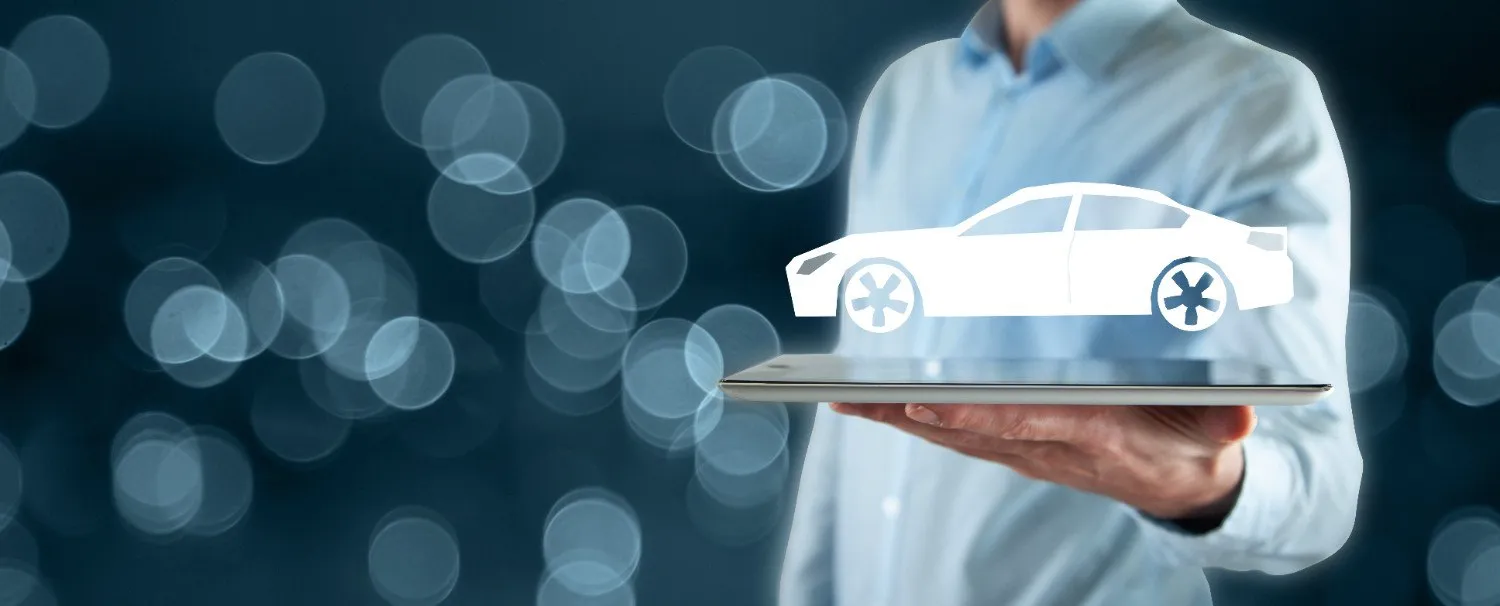 Person holding a tablet with a car icon above it